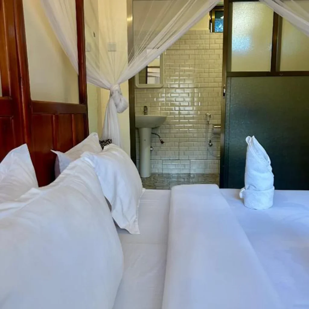 Deluxe double en-suite bedroom at Patamu Lodge Karatu